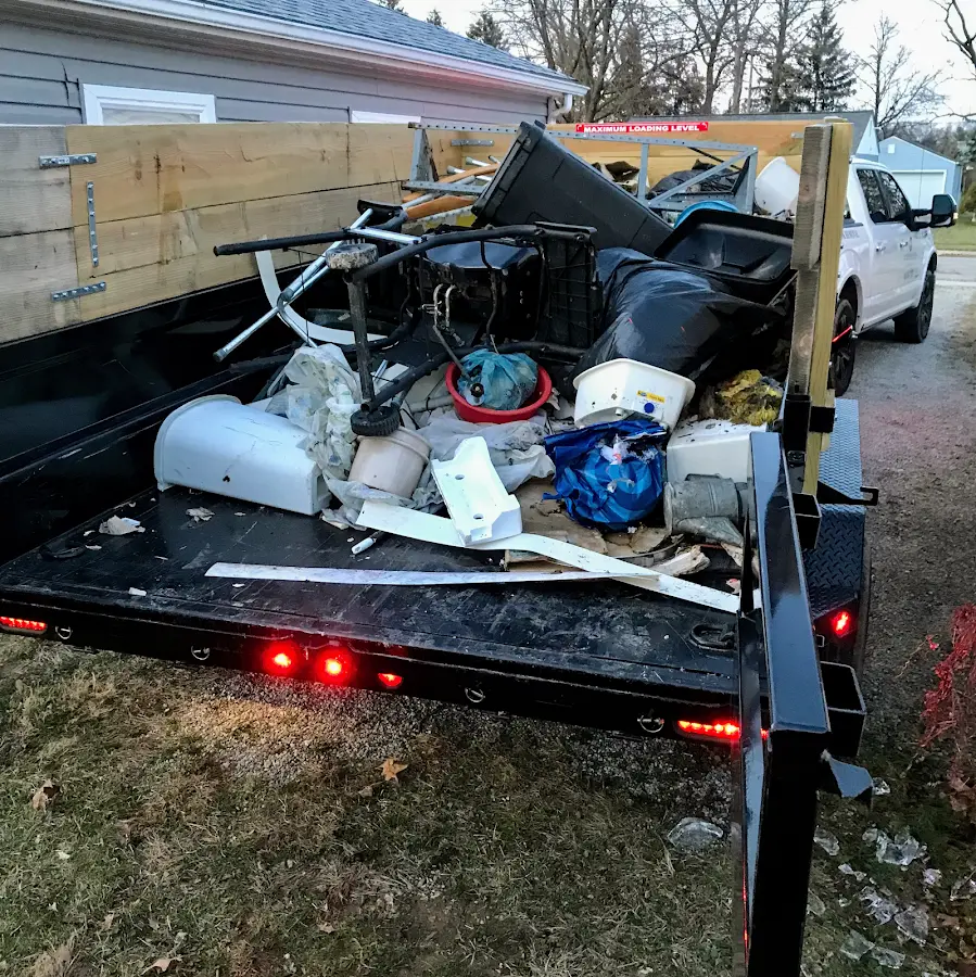 Roll-off dumpster delivered to a residential driveway in Grain Valley